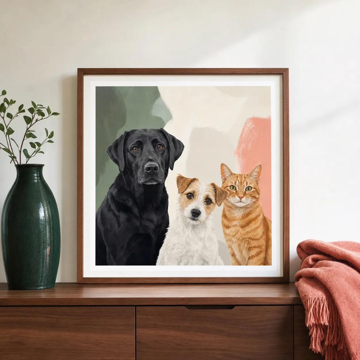 Framed family portrait of two dogs and an orange tabby cat